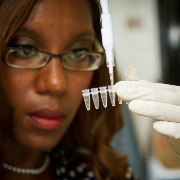 A genetic testing kit being held by a person’s hands. This image highlights the importance of personalized health solutions.