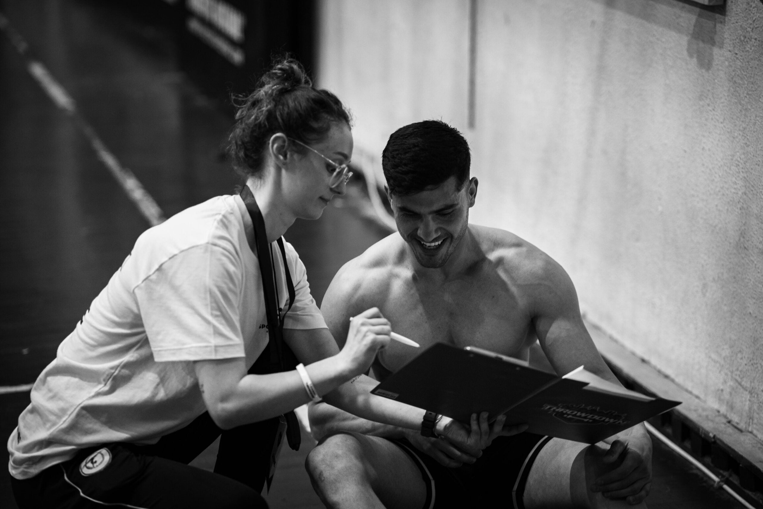 A person writing a fitness plan